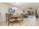Inviting dining room featuring a chandelier, neutral color palette, and seamless flow into the living area at 1250 River Oaks Dr. # 16B, Myrtle Beach, SC 29579
