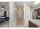 Hallway showcases tile floors leading to a bedroom, kitchen, and front door, enhancing home accessibility at 1250 River Oaks Dr. # 16B, Myrtle Beach, SC 29579