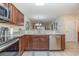 Open kitchen with stainless steel appliances and granite counters that lead to the living space at 1250 River Oaks Dr. # 16B, Myrtle Beach, SC 29579