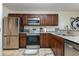Well-equipped kitchen boasting stainless steel appliances and granite countertops at 1250 River Oaks Dr. # 16B, Myrtle Beach, SC 29579