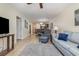 Bright open-concept living space with comfortable seating, tile floors, and kitchen view at 1250 River Oaks Dr. # 16B, Myrtle Beach, SC 29579