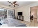 Living room area featuring sliding glass doors, a ceiling fan, and tile flooring at 1250 River Oaks Dr. # 16B, Myrtle Beach, SC 29579