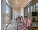 Comfortable screened porch with tiled floor and seating at 1250 River Oaks Dr. # 16B, Myrtle Beach, SC 29579