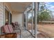 Spacious screened porch with tiled floor and wooded view at 1250 River Oaks Dr. # 16B, Myrtle Beach, SC 29579