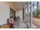 Comfortable screened porch with tiled floor and seating at 1250 River Oaks Dr. # 16B, Myrtle Beach, SC 29579