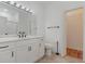 This bathroom features a white vanity with a marble countertop, a toilet, and access to the walk-in closet at 130 Lazy Willow Ln. # 204, Myrtle Beach, SC 29588