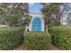 Bay View Golf Villas sign framed by lush greenery and mature trees, welcoming residents and guests at 130 Lazy Willow Ln. # 204, Myrtle Beach, SC 29588