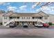 Inviting two-story condo building with ample parking and accessible ramp at 130 Lazy Willow Ln. # 204, Myrtle Beach, SC 29588