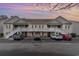 Exterior view of the building with ample parking and well-lit common areas, perfect for residents and visitors at 130 Lazy Willow Ln. # 204, Myrtle Beach, SC 29588