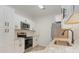 Bright kitchen features stainless steel appliances, white cabinetry and sink with modern faucet at 130 Lazy Willow Ln. # 204, Myrtle Beach, SC 29588