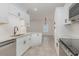 Open-concept kitchen boasting stainless steel appliances and seamless access to the living area at 130 Lazy Willow Ln. # 204, Myrtle Beach, SC 29588