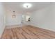 Spacious living room showcasing hardwood floors and a seamless flow to the adjacent dining area at 130 Lazy Willow Ln. # 204, Myrtle Beach, SC 29588