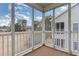 Relaxing screened-in patio showcasing outdoor living space with views of the surrounding yard at 130 Lazy Willow Ln. # 204, Myrtle Beach, SC 29588