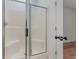 This shower features a semi-transparent glass door and a white surround at 130 Lazy Willow Ln. # 204, Myrtle Beach, SC 29588