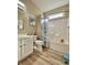 Clean bathroom featuring a shower-tub combo, white vanity, and coastal-themed shower curtain at 144 Harbor Lights Dr., Surfside Beach, SC 29575