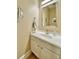 Clean bathroom with a white vanity, silver faucet, a large mirror, and coastal decor at 144 Harbor Lights Dr., Surfside Beach, SC 29575