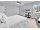 Cozy bedroom with natural light, modern ceiling fan, and neutral decor for restful nights at 145 Bendick Ct., Little River, SC 29566