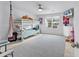 Bright bedroom featuring a bunk bed, soft carpet, and ample natural light at 145 Bendick Ct., Little River, SC 29566