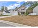 Charming two-story home featuring a well-manicured lawn, inviting front porch, and attached garage at 145 Bendick Ct., Little River, SC 29566