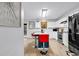 Bright kitchen with an island, seating, stainless steel appliances, and ample counter space at 145 Bendick Ct., Little River, SC 29566