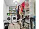 Functional laundry room with washer, dryer, storage shelves, and organized space at 145 Bendick Ct., Little River, SC 29566