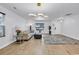 Open concept living room with modern lighting, neutral colors, and hardwood floors at 145 Bendick Ct., Little River, SC 29566