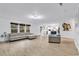 Bright and airy living room featuring plank flooring with combined kitchen and living area at 145 Bendick Ct., Little River, SC 29566