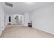 Open living room with neutral walls, plush carpet, and a cozy ambiance at 145 Bendick Ct., Little River, SC 29566
