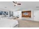 Spacious main bedroom featuring an ensuite sitting area and custom media wall unit at 145 Bendick Ct., Little River, SC 29566