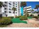 Exterior of building featuring palm trees and landscaping at 1605 S Ocean Blvd. # 509, Myrtle Beach, SC 29577