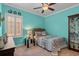 This cozy bedroom features one bed, bright walls, and a decorative display cabinet at 1685 Sapphire Dr., Longs, SC 29568