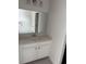 Bathroom featuring white cabinets, granite countertop, faucet and mirror at 175 Glengrove Lane, Murrells Inlet, SC 29576