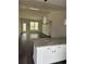Open floor plan featuring living room with wood floors, white trim, vaulted ceiling and stylish pendant lights at 175 Glengrove Lane, Murrells Inlet, SC 29576