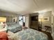 Cozy bedroom featuring two beds with patterned quilts, a TV, and access to the kitchen at 201 N 74Th Ave. N # 2322, Myrtle Beach, SC 29572