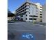 Exterior view of condominium building with handicap access and blue sky in background at 201 N 74Th Ave. N # 2322, Myrtle Beach, SC 29572