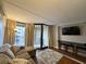 Living room featuring a sofa, media console, and balcony with a view at 201 N 74Th Ave. N # 2322, Myrtle Beach, SC 29572