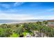 Stunning aerial view of manicured lawns, a sandy beach, and the beautiful Atlantic Ocean at 2106 N Ocean Blvd. # 410, Myrtle Beach, SC 29572