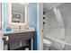 Modern bathroom with a sleek vanity, stylish mirror, and a shower with tub at 2106 N Ocean Blvd. # 410, Myrtle Beach, SC 29572