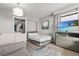 Contemporary bedroom features a comfortable bed, TV, and plenty of natural light at 2106 N Ocean Blvd. # 410, Myrtle Beach, SC 29572