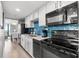 Well-equipped kitchen with stainless steel appliances, ample counter space, and modern cabinetry at 2106 N Ocean Blvd. # 410, Myrtle Beach, SC 29572
