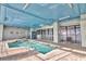 Indoor pool area with ample seating, tile flooring, and a blue painted ceiling at 2106 N Ocean Blvd. # 410, Myrtle Beach, SC 29572