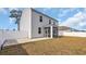 The backyard features a concrete patio and a screened porch, enclosed by a white privacy fence at 220 Forestbrook Cove Circle, Myrtle Beach, SC 29588