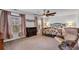Comfortable bedroom featuring neutral carpet, large windows, and stylish furnishings at 220 Forestbrook Cove Circle, Myrtle Beach, SC 29588
