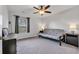 Neutrally decorated bedroom with a ceiling fan, window with blinds, and functional furniture at 220 Forestbrook Cove Circle, Myrtle Beach, SC 29588