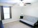 Bedroom showcasing a neutral color scheme, ceiling fan, and a comfortable futon, perfect for relaxation or guests at 220 Forestbrook Cove Circle, Myrtle Beach, SC 29588