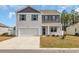 Charming two-story home featuring a two-car garage and a well-maintained lawn on a sunny day at 220 Forestbrook Cove Circle, Myrtle Beach, SC 29588