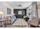 Beautifully staged living room features modern decor, including a stylish sofa and accent wall at 220 Forestbrook Cove Circle, Myrtle Beach, SC 29588
