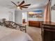 Spacious main bedroom featuring a ceiling fan, beach artwork, and dark wood furniture at 220 Forestbrook Cove Circle, Myrtle Beach, SC 29588