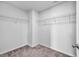 A clean, walk-in closet offers ample storage with wire shelving and neutral carpeting at 220 Forestbrook Cove Circle, Myrtle Beach, SC 29588