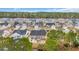 Expansive aerial view of a neighborhood with well-maintained homes and mature trees at 224 Cupola Dr., Longs, SC 29568